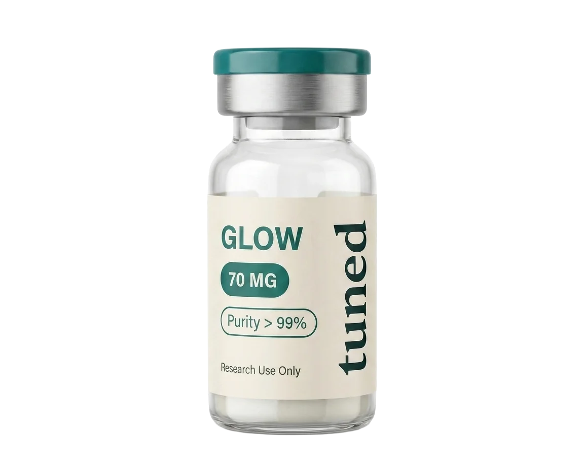 Clear glass vial with a teal cap, silver collar and cream label